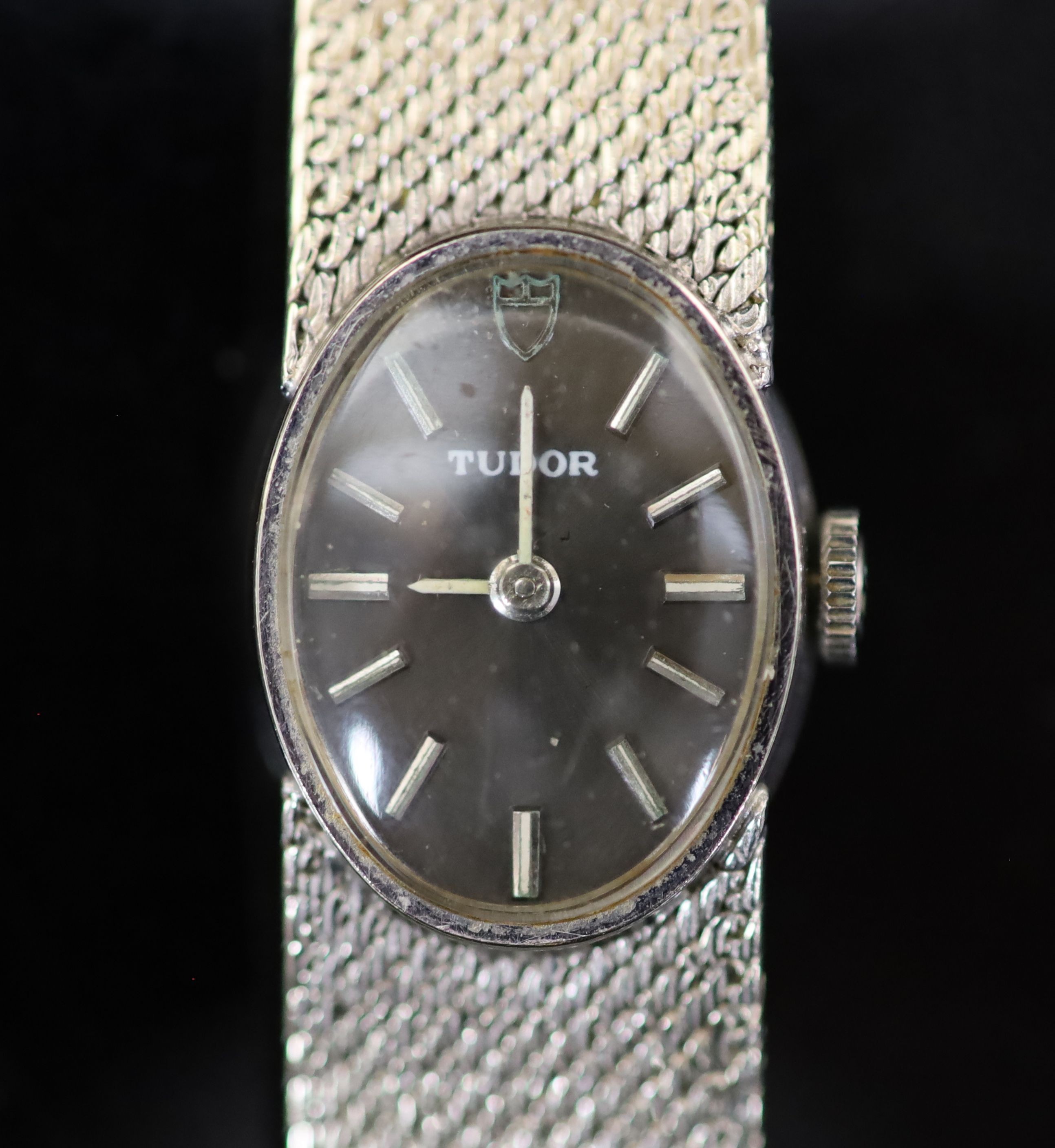 A lady's 9ct white gold Tudor manual wind oval wrist watch